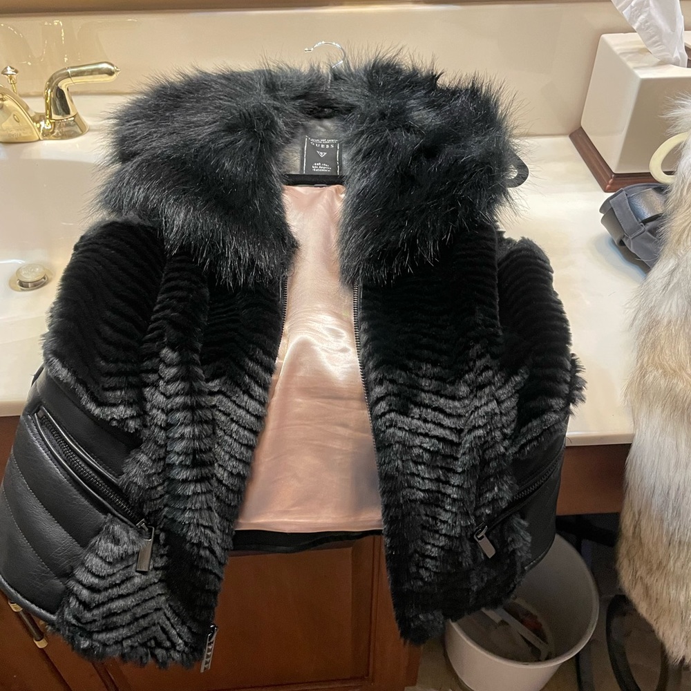 Guess faux fur and faux leather vest.  Like new!  Very sexy!!
